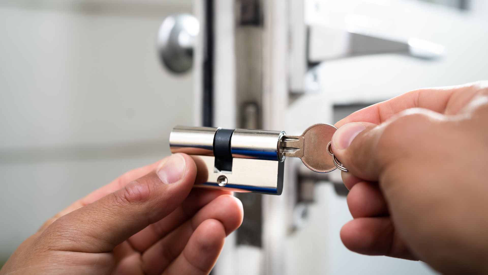 locksmith working on commercial lock