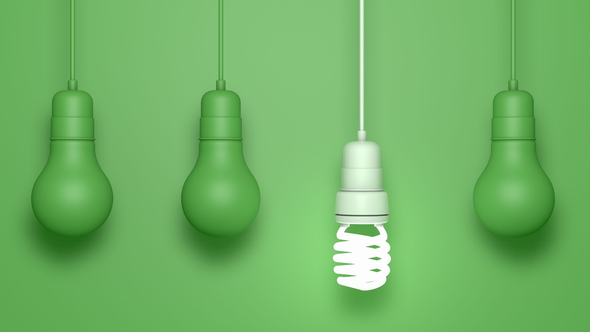 green hanging light bulbs and one white LED bulb