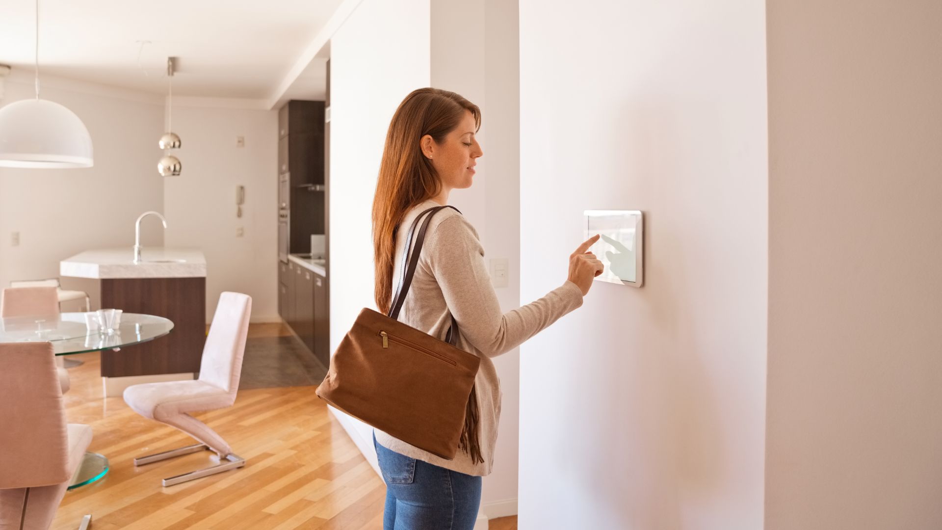 A woman using a home security system