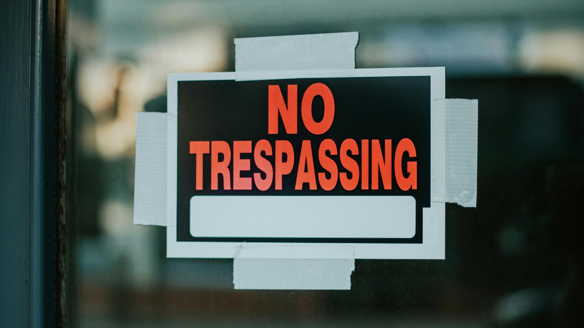 "No Trespassing" sign on a business's front door